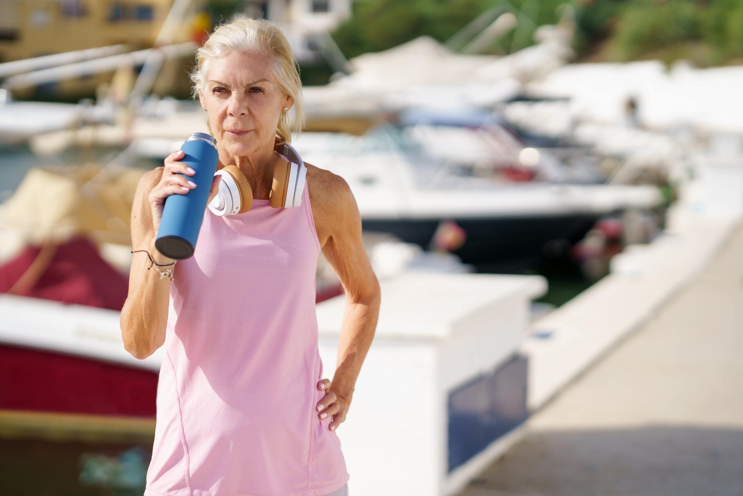 senior-sportswoman-drinking-water-during-training-2022-03-16-00-27-19-utc-min