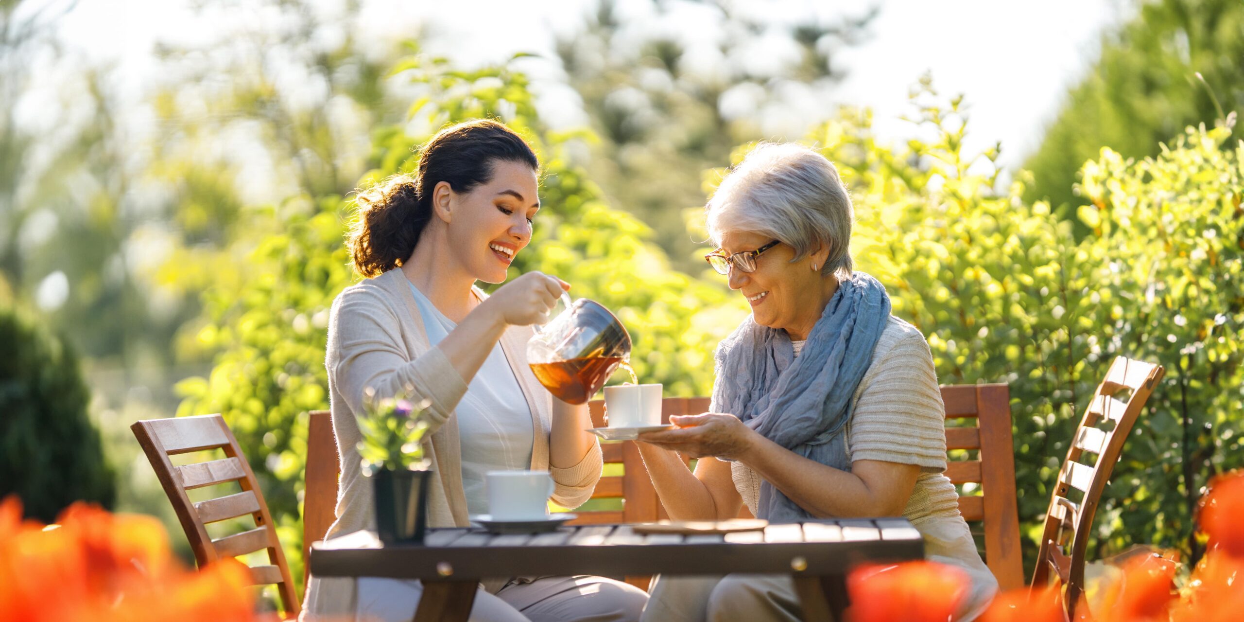 women-drinking-tea-in-the-garden-2023-11-27-05-08-45-utc-min