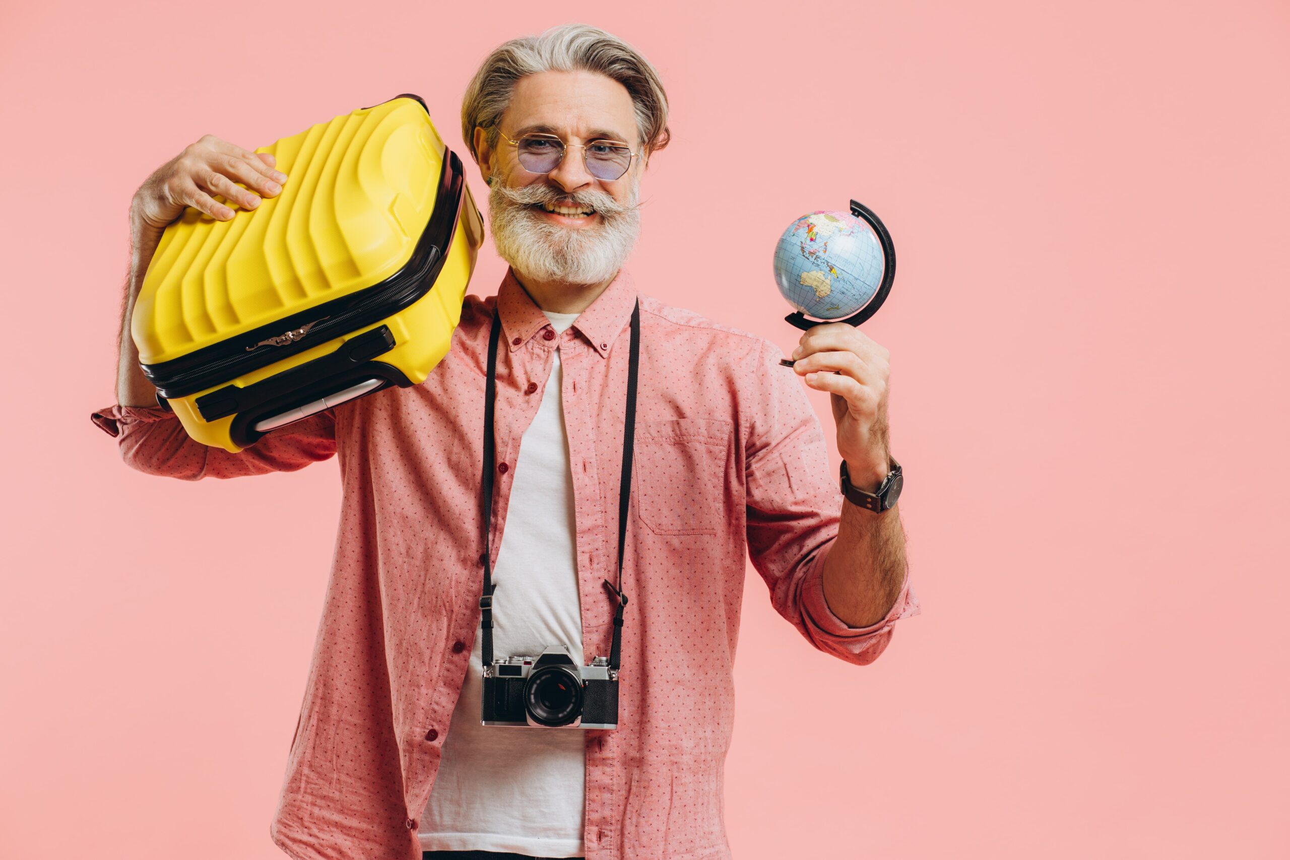 happy-bearded-man-in-sunglasses-with-a-camera-hold-2023-11-27-05-06-55-utc-min