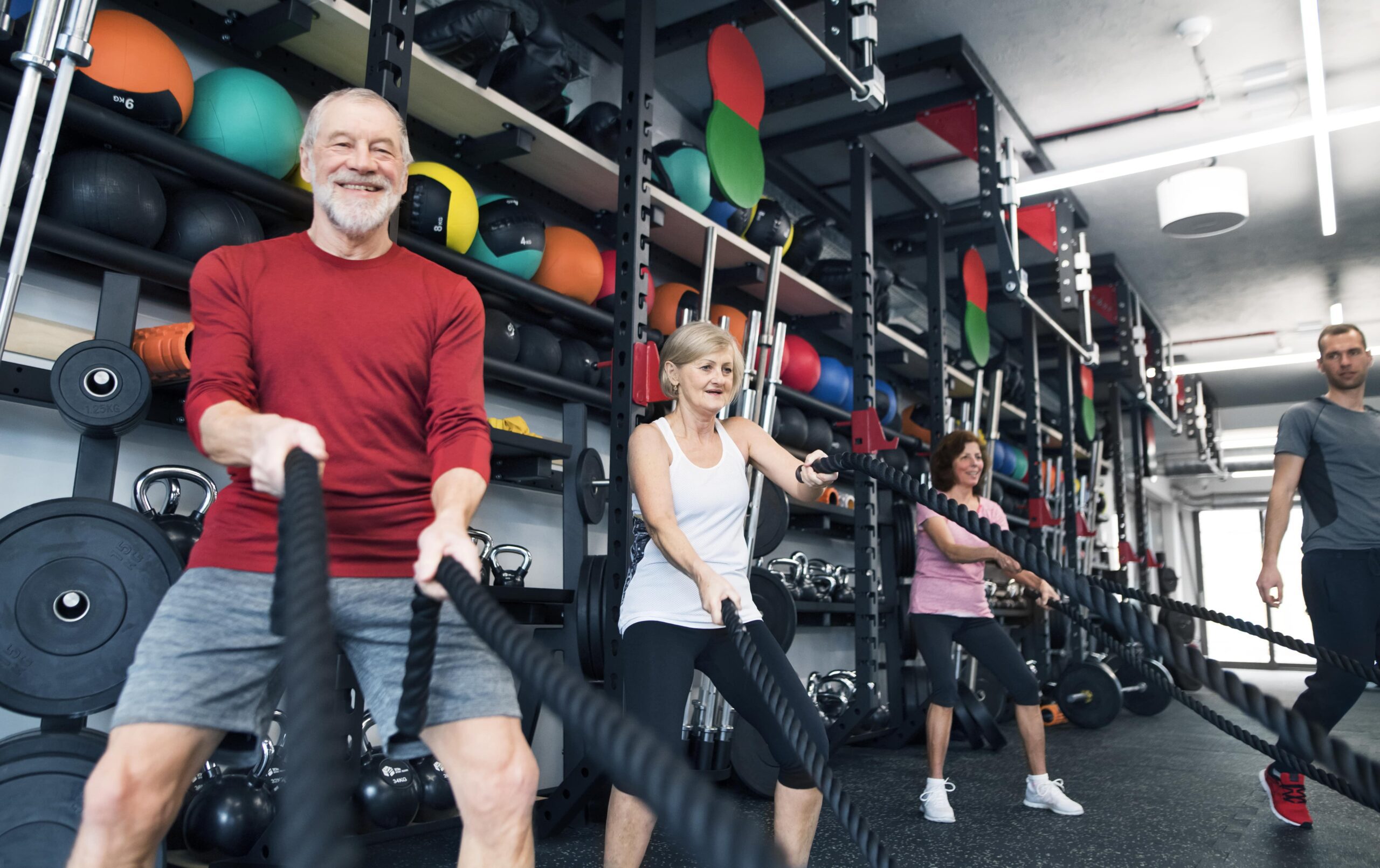 seniors-in-gym-working-out-with-battle-ropes-2024-09-22-11-42-51-utc-min