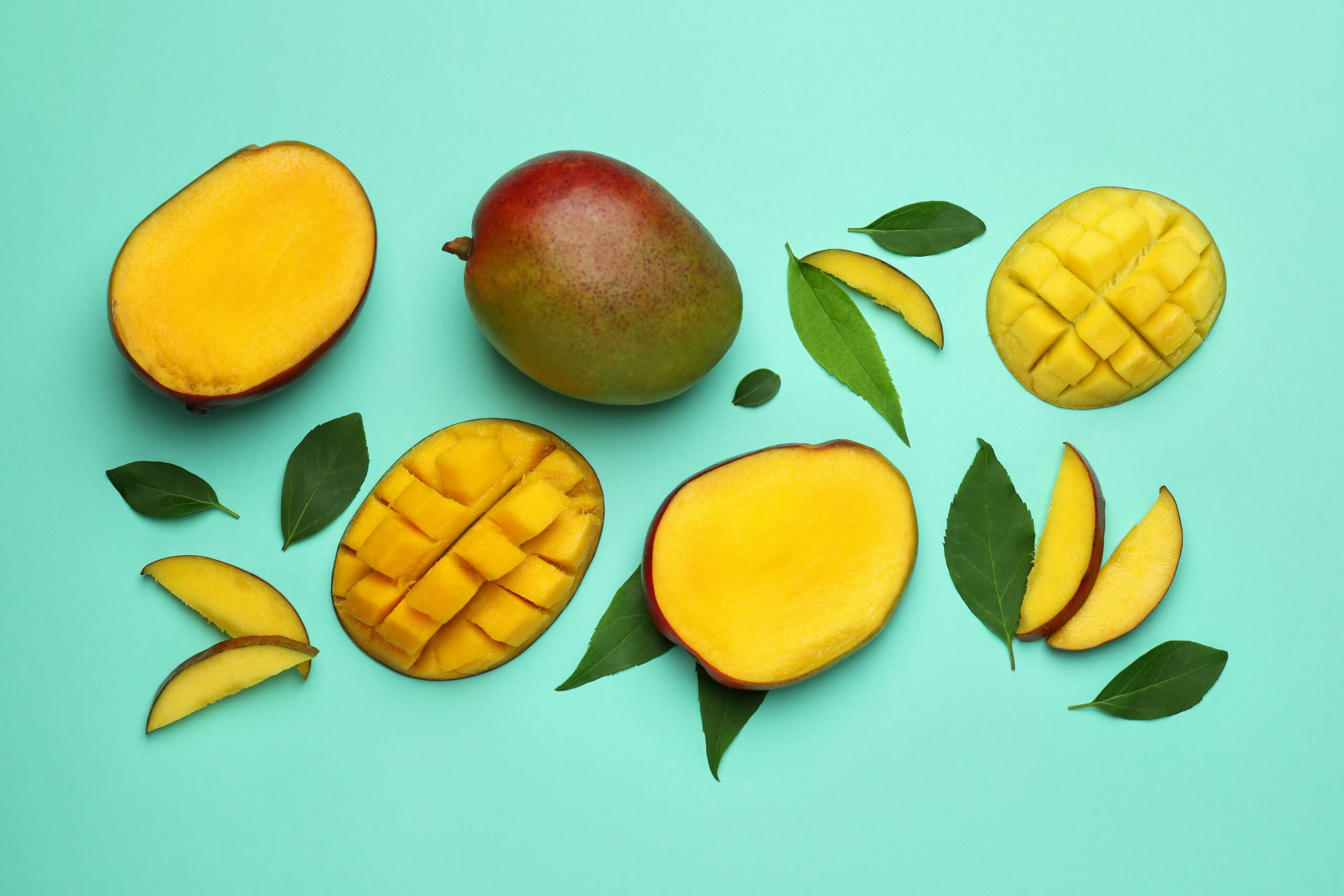 tasty-ripe-mango-fruit-on-mint-background-2023-11-27-05-17-39-utc-min